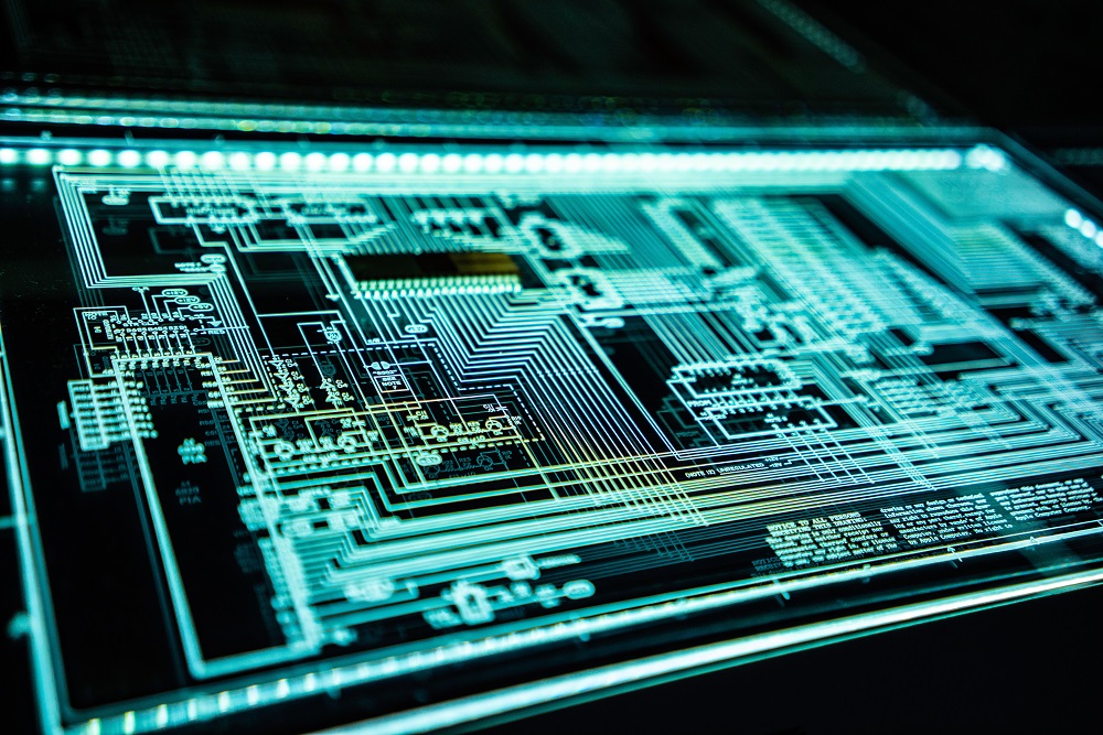 an advanced integrated circuit outlined with bright light on glass